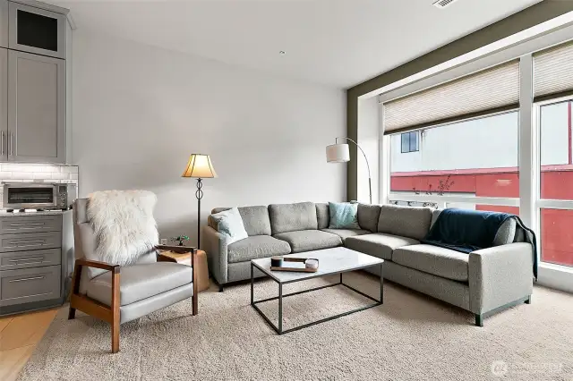 The expansive living area offers ample space for comfortable seating and stylish decor.