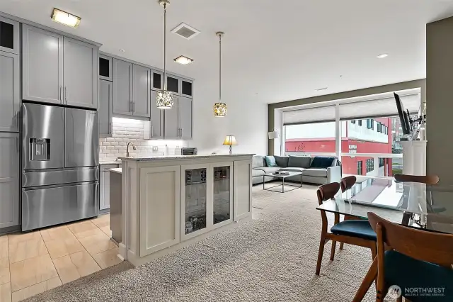 The kitchen is equipped with stainless steel appliances, quartz countertops and soft close cabinetry and tile flooring. All appliances remain with the sale of the condo.