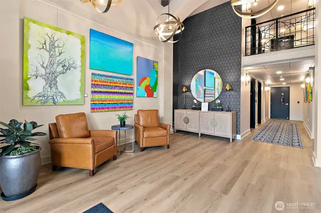 The newly renovated Roberson lobby was designed with tasteful artwork , comfortable seating and custom lighting creating a warm and inviting atmosphere.
