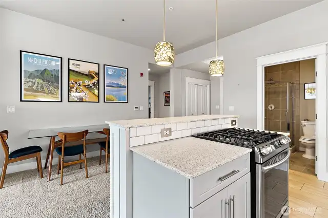 Beautiful pendant lighting adds a touch of elegance, illuminating the space and enhancing its contemporary charm.