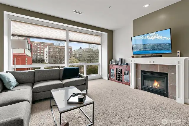 The heart of the living space is the beautiful gas fireplace with a custom mantle creating a warm and stylish focal point.