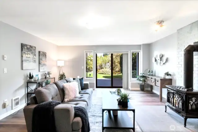Huge lower level family room with high ceilings and slider d  oor to back yard
