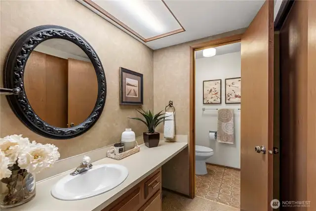 Primary bath with closet space.