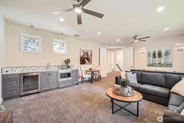 Wet bar featuring a beverage refrigerator and microwave drawer—perfect for movie nights and entertaining guests in style.