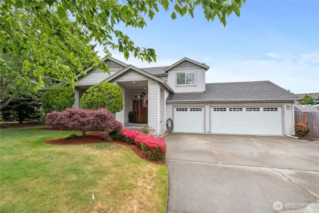 Welcome home. The property features a spacious driveway that can accommodate multiple vehicles.