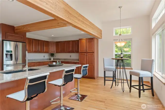 There is sufficient space for a kitchen table and additional bar stools at the island.