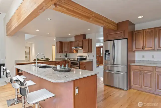 Spacious island accommodating up to five bar stools.