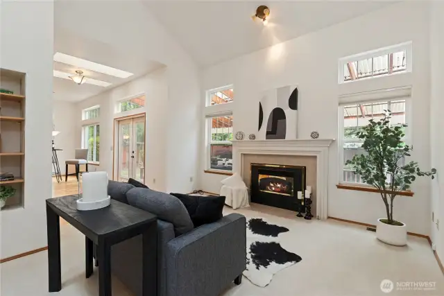 The family room windows offer a view of the well-maintained backyard.
