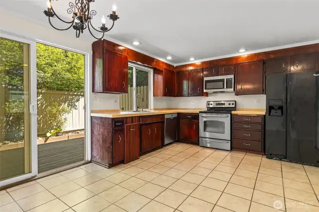 Tiled Kitchen & Dining Area w/ slider leading to back deck~