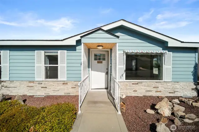 Inviting entryway with classy low-maintenance landscaping.