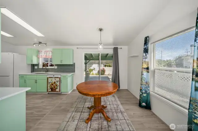 Dining room with sliding glass doors to the back.