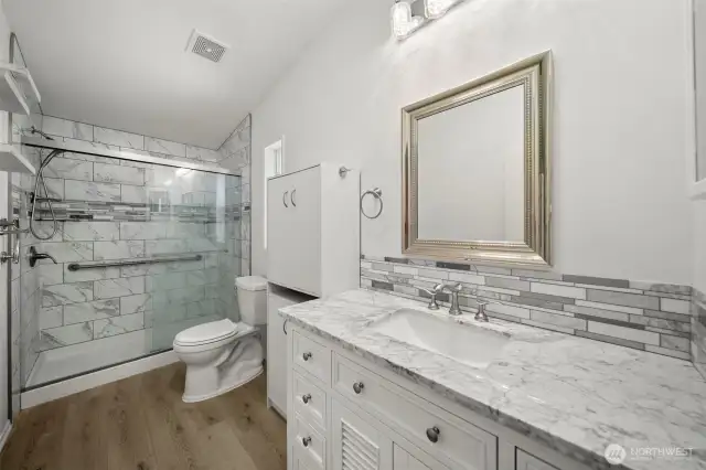 Primary bathroom with large walk-in shower.