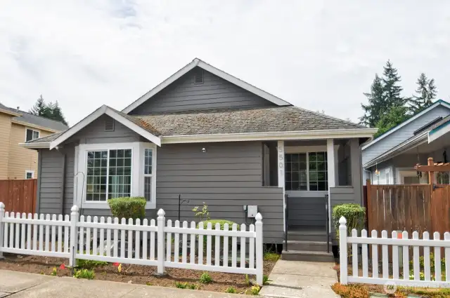 Picket fence giving you the charming neighborhood Vibe for this adorable one level easy maintenance rambler