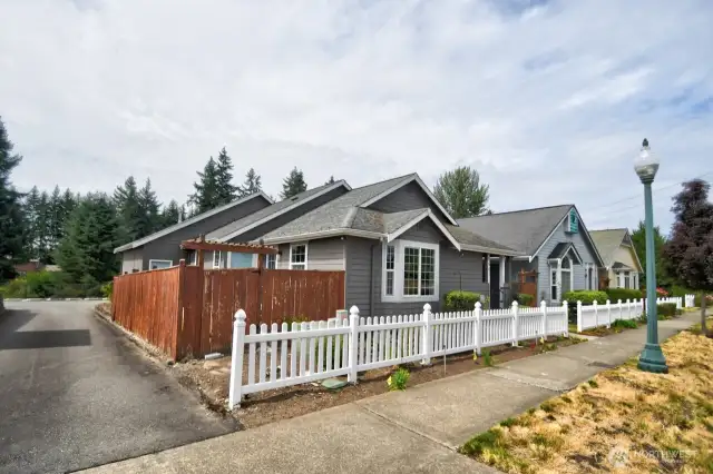 Corner Lot with an alley for a back entrance garage gives this house even more Wow Factor!