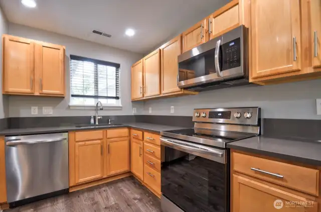 Another View of the Kitchen with a window looking out the back.