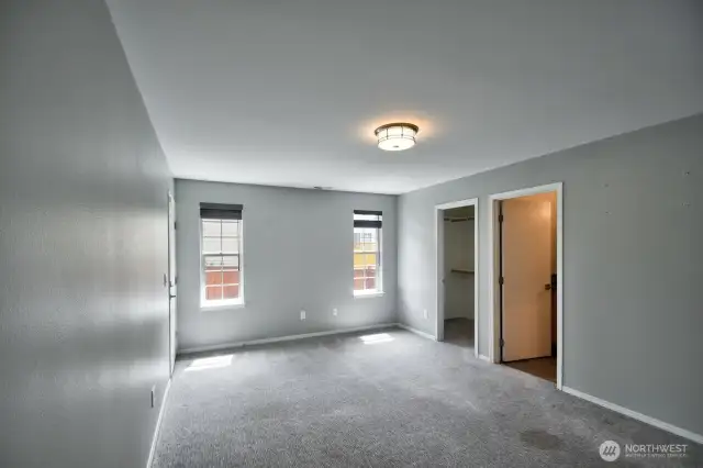 Primary Bedroom. Has a door to the side yard too.