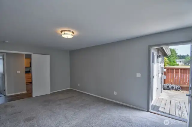 Primary Bedroom, showing the door to the side yard.