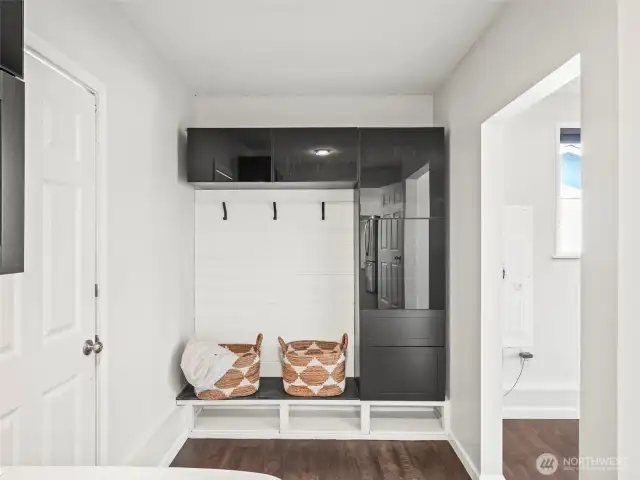 Mud room cabinets in laundry help you stay organized - W/D included!