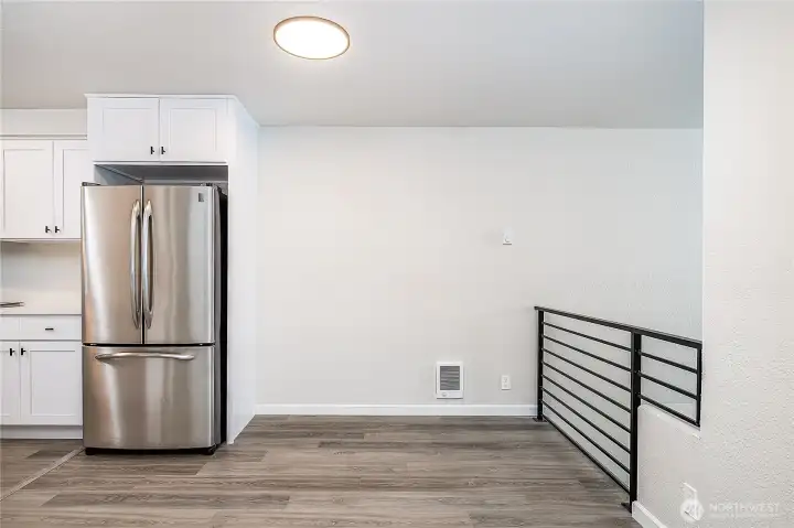 Charming dining nook with modern design, natural light, and convenient access to the kitchen.