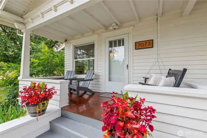 Your covered front porch with solid hardwood flooring