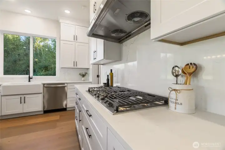 Gorgeous Counters, Incredible Solid Backsplash, Gas Range, Impressive Hood, Apron Sink & Plenty of Storage ...