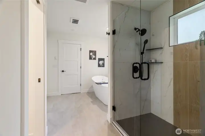 Double Shower Heads in this Light Filled Glass Door Shower ...