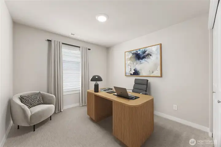 1 of 4 upstairs bedrooms virtually staged as an office.