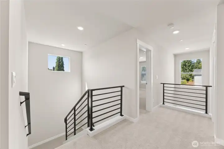 Open and airy upstairs landing, with 2 story entry!