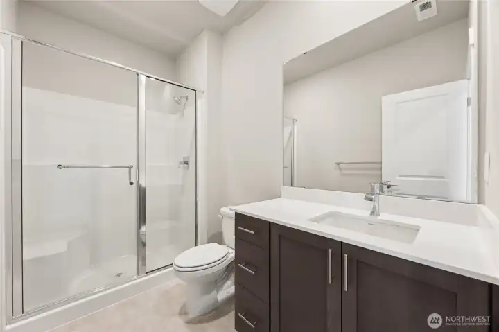 Main floor 3/4 bath, next to bedroom or den.