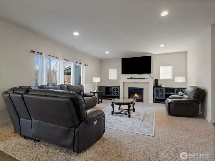 Spacious living room with abundant natural light, perfect for relaxing or entertaining.