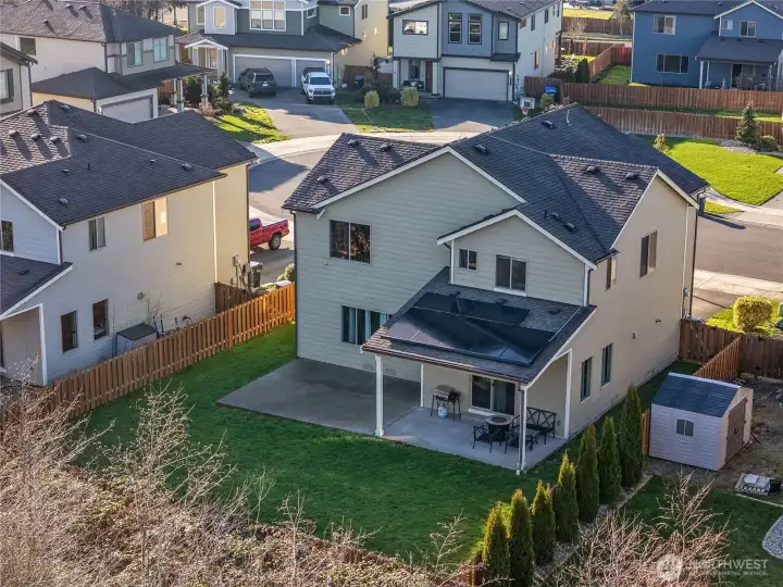 Spacious fenced backyard backing to open space, with no neighbors behind.