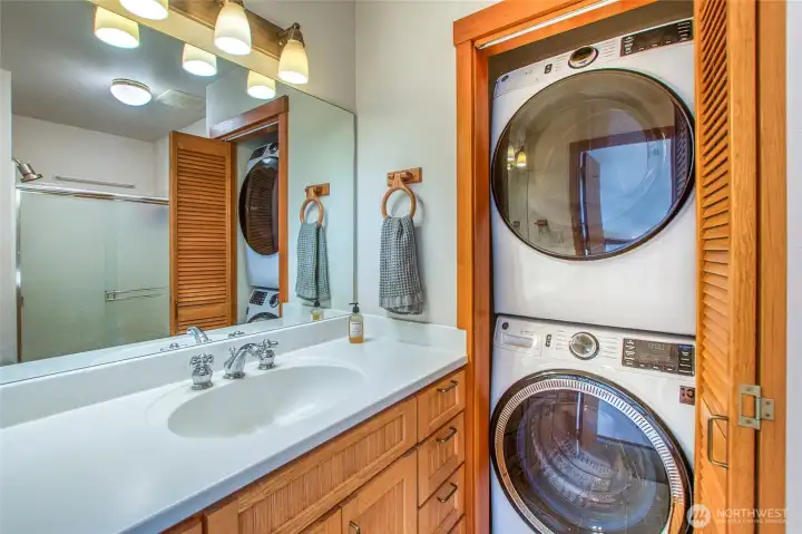 Main floor bathroom with laundry and new towel heater