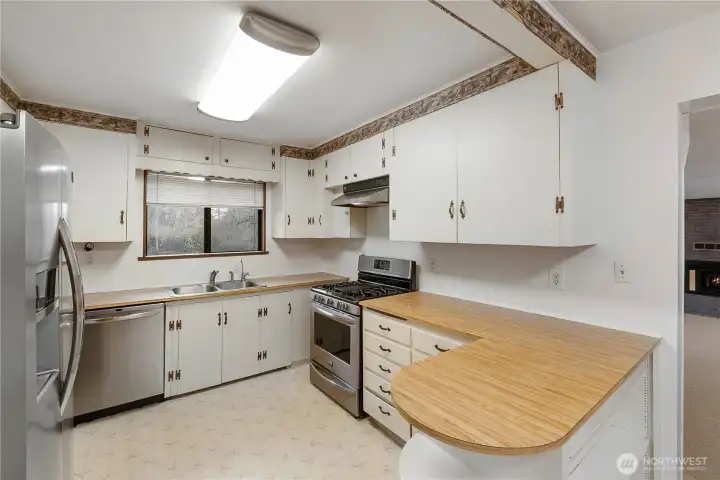 Classic kitchen with plenty of workspace and potential to modernize while enjoying as-is.