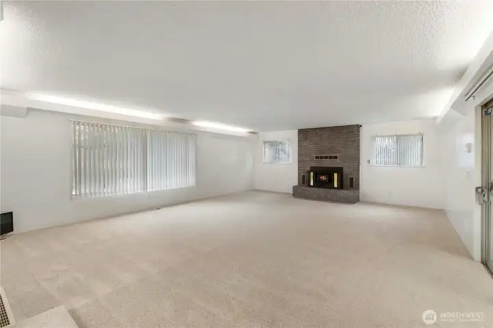 Incredible main living area with fresh paint, new carpet, and recessed lighting—offering excellent flexibility for furniture layout and everyday living.