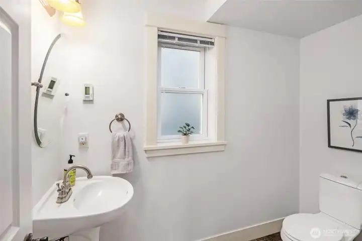 A guest powder room completes the main floor.
