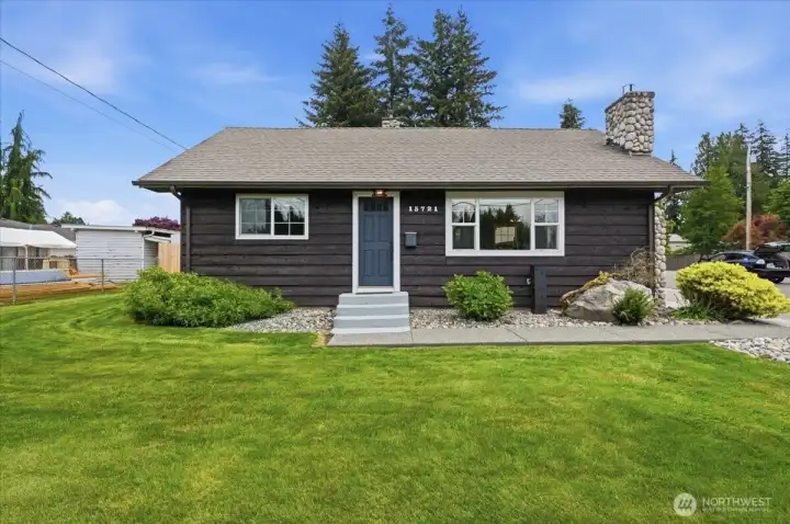 The lawn on the front yard welcomes loved ones and guests to the front door.