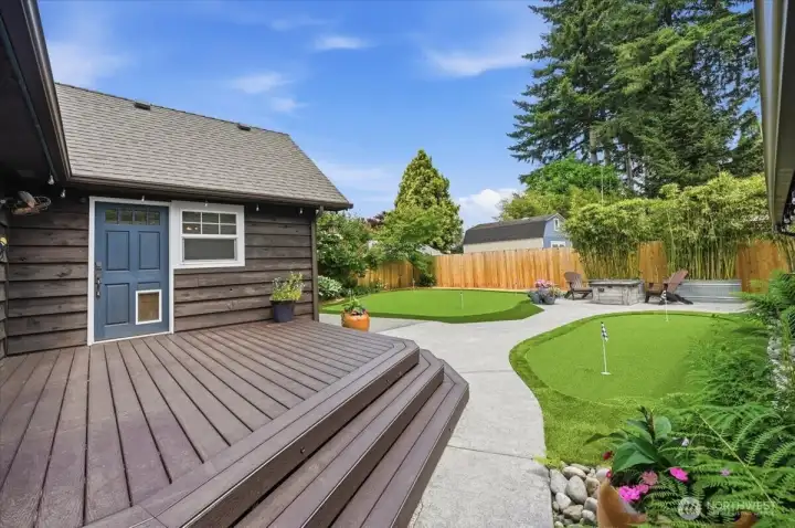 Composite deck leading to backyard oasis.