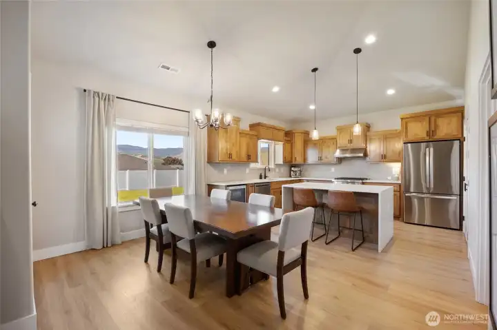 Dining + kitchen with mountain views Dining + kitchen with mountain views