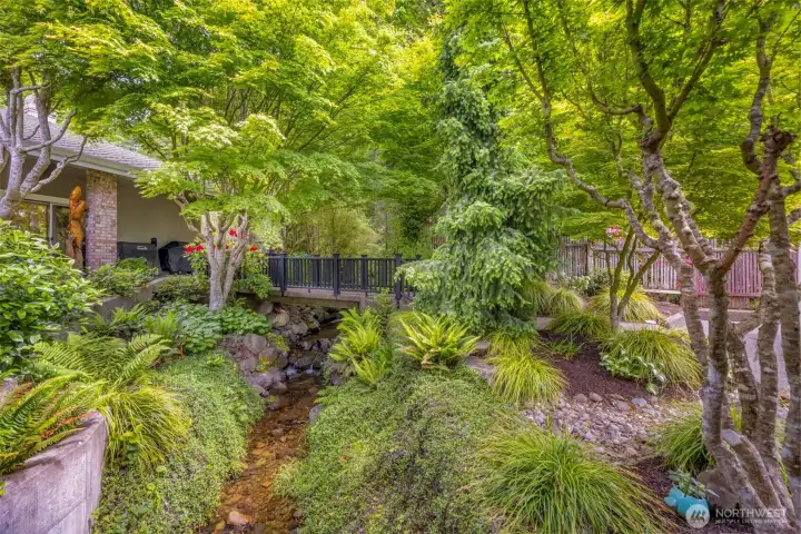 The view from the covered walk. The stream and gardens. The view from the covered walk. The stream and gardens.