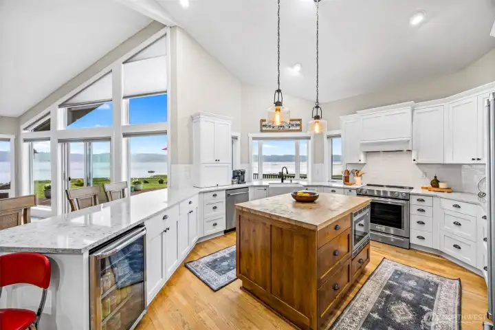 The beautiful kitchen is complimented with hardwood floors, stainless steel appliances & quartz counters. The beautiful kitchen is complimented with hardwood floors, stainless steel appliances & quartz counters.
