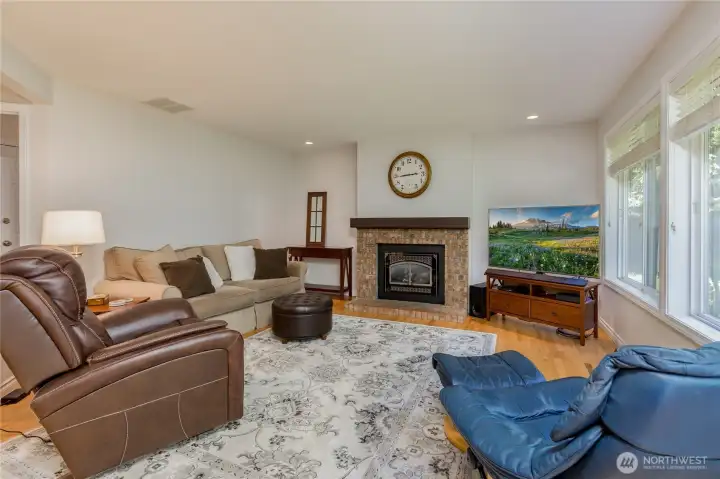 A cozy gas fireplace anchors the family room off the kitchen.