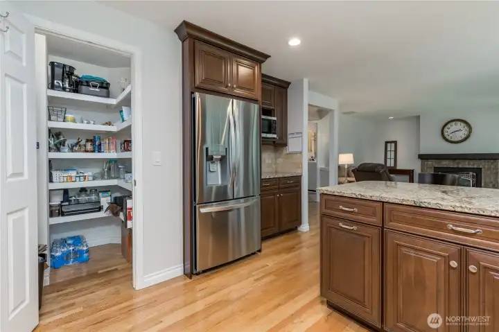 Convenient walk-in pantry keeps all your essentials at hand.