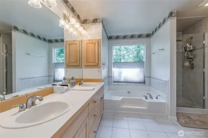 Spacious 5-piece primary bath with tiled floor