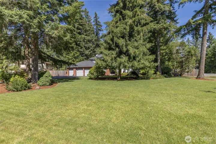 Set back from the street, this home features a large front yard that provides both stunning curb appeal and exceptional privacy.
