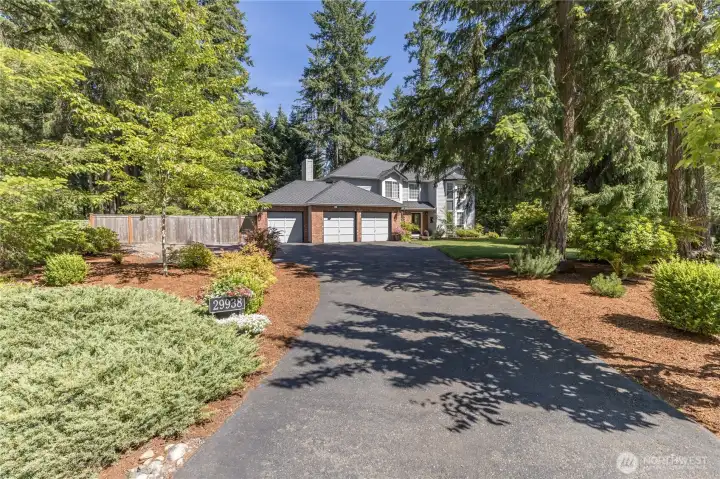Enjoy the convenience of an expansive driveway, offering ample off-street parking and easy access to the spacious three-car garage.
