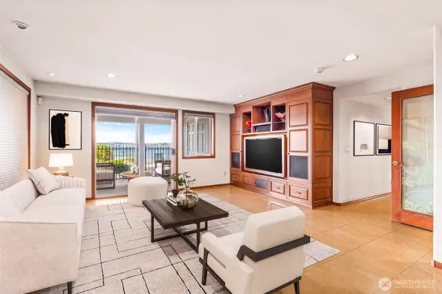 Virtually staged Family room downstairs with access to back yard patio. Also has heated/cooled outdoor kennel for your fur baby.