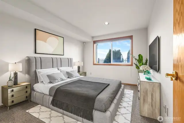 Virtually staged-  One of two bedrooms downstairs.