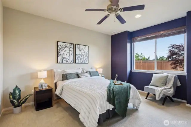 Primary Bedroom with bump-out window plus ceiling fan
