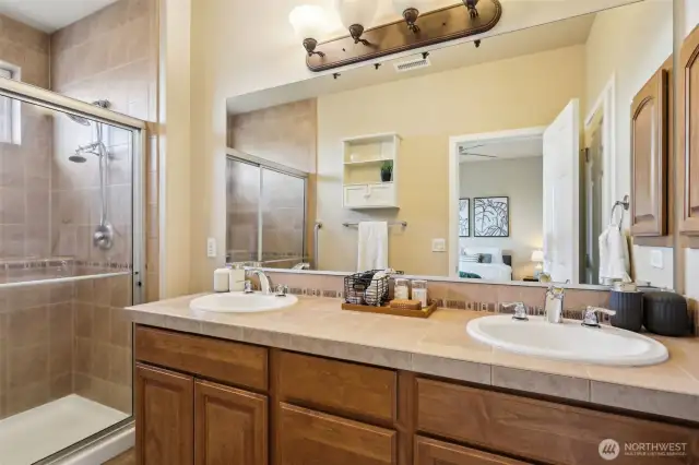 Primary Ensuite including dual vanities, walk-in shower, Full tile, floor-to-ceiling.