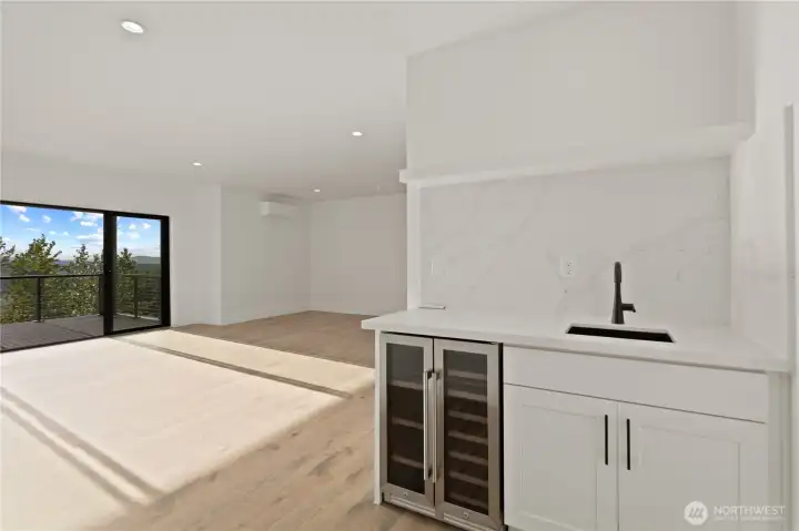 & even has a second wet bar & deck!